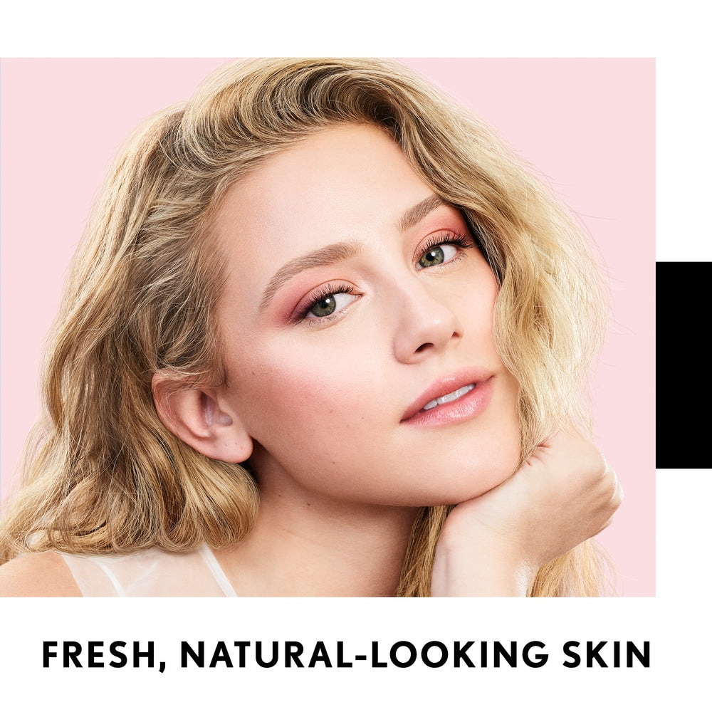 Model with fresh, natural-looking skin showcasing Clean Fresh Pressed Powder.
