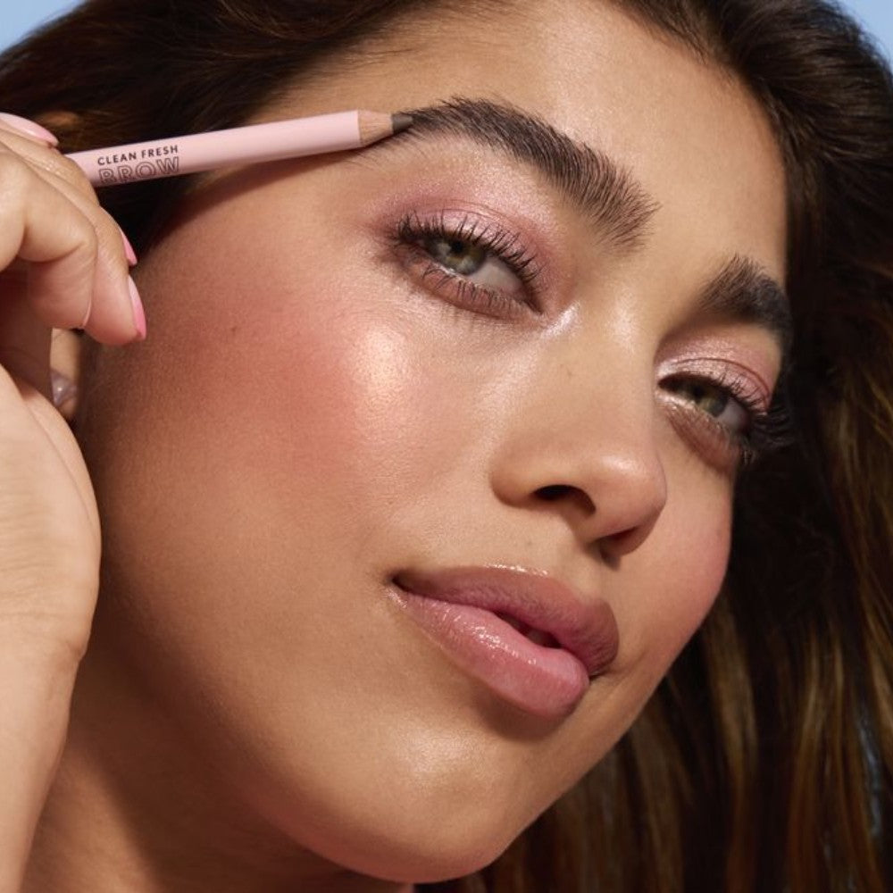 Model applying Clean Fresh Brow Volumizer Fiber Powder Pencil.