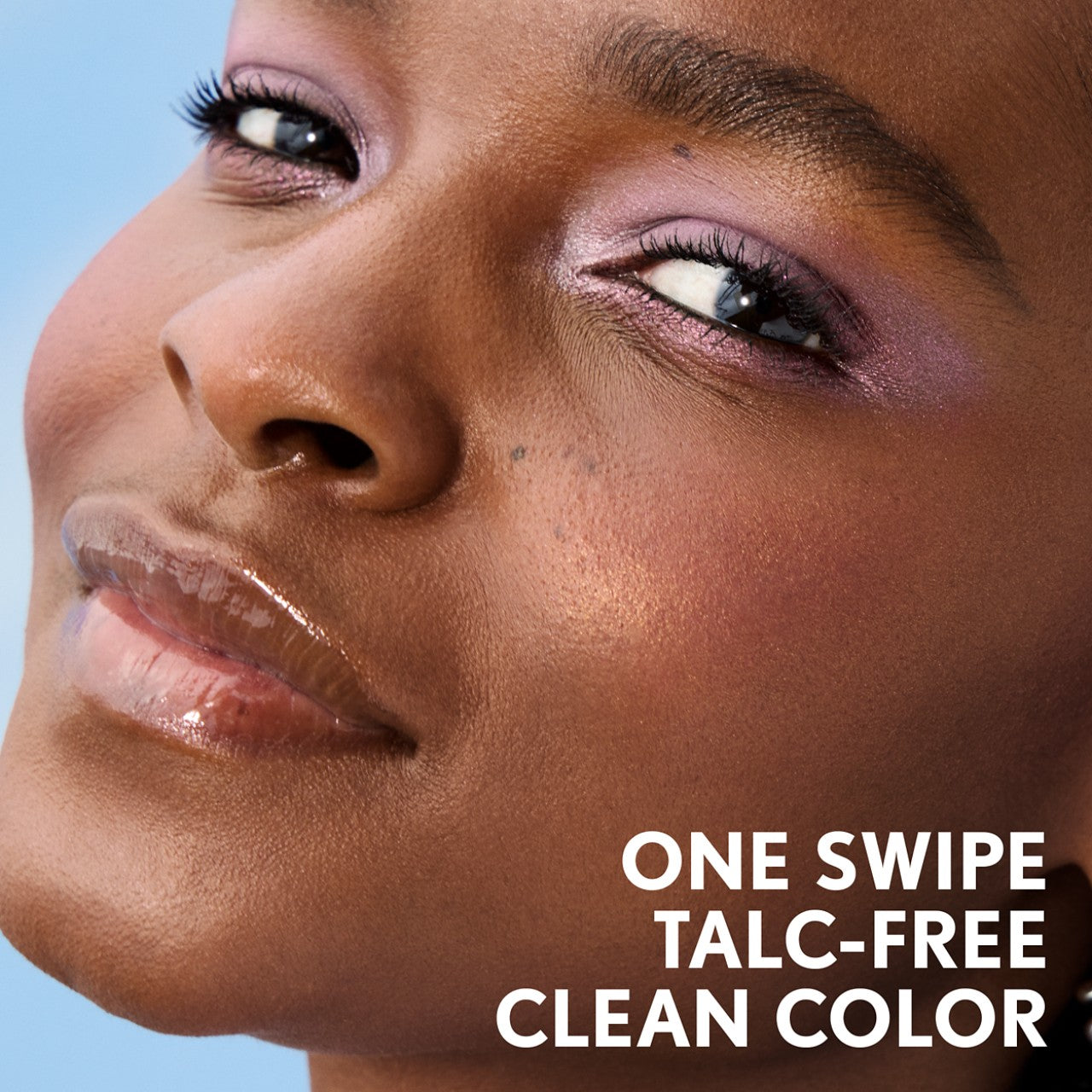 Model showcasing Clean Fresh Clean Color Eyeshadow. One swipe talc-free clean color.