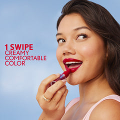 Model applying CoverGirl Clean Lip Color in Satin Slipper. 1 swipe creamy comfortable color.