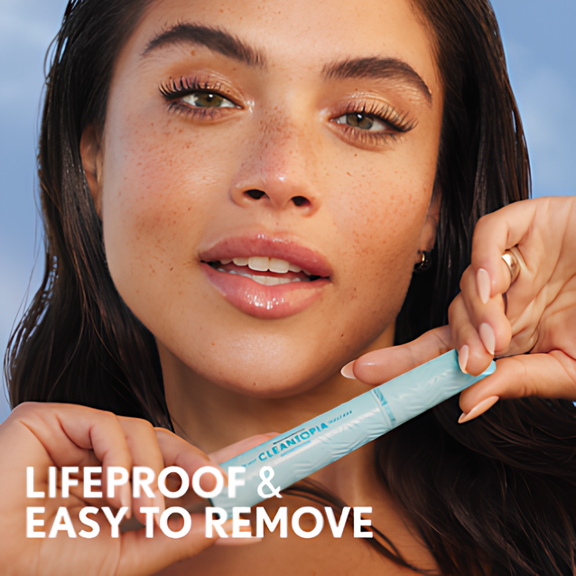 Model holding COVERGIRL Lash Blast Cleantopia Waterproof mascara. Lifeproof and easy to remove.